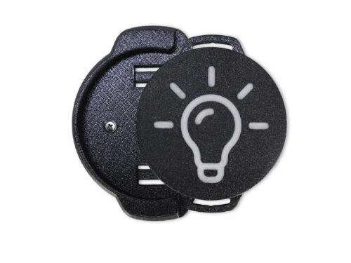Schwarzer Funktaster mit hellem Lichtsymbol, eingeklickt in eine Flexihalterung